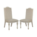Caelum 7-Piece Round Dining Set with White Fabric Upholstery by The Gray Barn